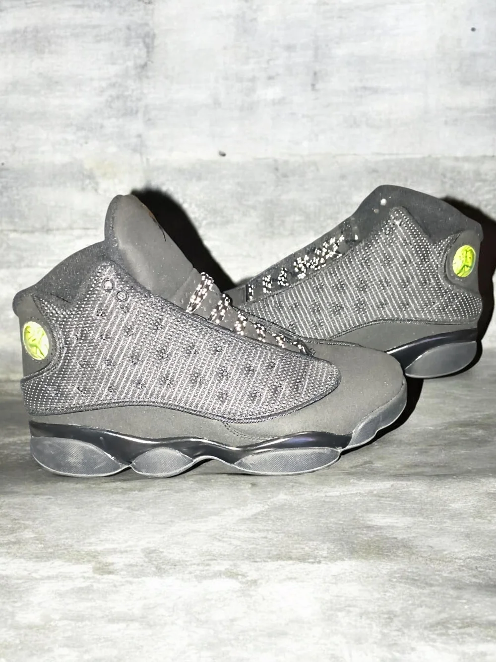 All-Black Jordan 13 Retro Basketball Sneakers with Lime Logo Accent